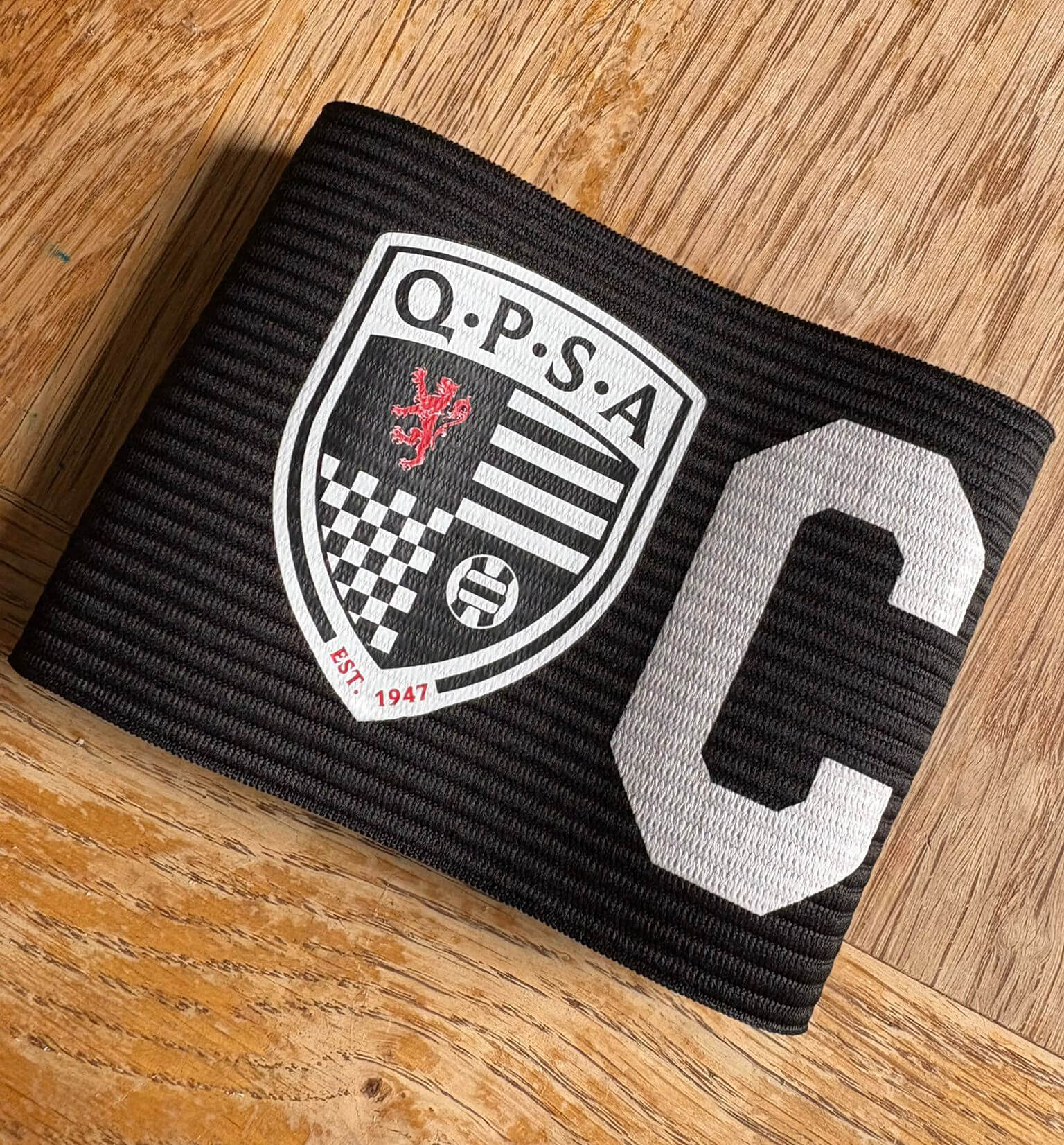 the new logo crest design for Queens Park Supporters Association